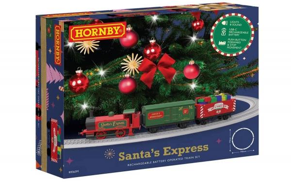 Hornby Santa's Express rechargeable battery operated train track set in its retail packaging, featuring a Christmas tree decorated with ornaments and a red Santa locomotive.